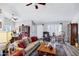 Spacious living room with wood flooring, natural light, and comfortable seating arrangement at 949 E Piute Ave, Phoenix, AZ 85024