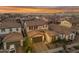 Aerial view of a home with a brown roof in a neighborhood at sunset at 9730 E Resistance Ave, Mesa, AZ 85212