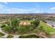 Aerial view of a neighborhood park with a covered pavilion, lush green grass, and walking paths at 9730 E Resistance Ave, Mesa, AZ 85212