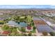 Scenic aerial view featuring a serene lake, vibrant green spaces, and community gardens in a residential area at 9730 E Resistance Ave, Mesa, AZ 85212