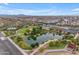 Aerial view featuring a lake, walking paths, and residential community at 9730 E Resistance Ave, Mesa, AZ 85212