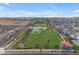 Aerial view of a community park adjacent to homes, complete with landscaped areas and walking paths at 9730 E Resistance Ave, Mesa, AZ 85212