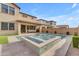 Stunning backyard pool and spa area with travertine pavers, perfect for relaxation and entertaining guests at 9730 E Resistance Ave, Mesa, AZ 85212