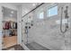 Bright bathroom with a glass enclosed shower and a view of the walk-in closet at 9730 E Resistance Ave, Mesa, AZ 85212