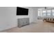 Bedroom view featuring a gray cabinet, a mounted television, and neutral decor at 9730 E Resistance Ave, Mesa, AZ 85212