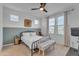 Comfortable bedroom with wainscoting, a ceiling fan, and lots of natural light at 9730 E Resistance Ave, Mesa, AZ 85212