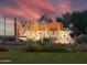 Beautiful community entrance sign welcomes residents and guests to Eastmark with colorful lighting at 9730 E Resistance Ave, Mesa, AZ 85212