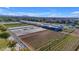 Aerial view of the community garden with rows of crops and greenhouse at 9730 E Resistance Ave, Mesa, AZ 85212