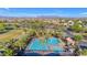 Community pool surrounded by palm trees and lounge chairs with mountain views in background at 9730 E Resistance Ave, Mesa, AZ 85212