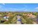 Aerial community view showing pool, stage, restaurant, and community center with surrounding neighborhood at 9730 E Resistance Ave, Mesa, AZ 85212