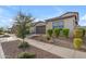 Inviting single-Gathering home features a desert landscaped front yard and a two-car garage at 9730 E Resistance Ave, Mesa, AZ 85212