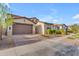 Beautiful single-Gathering home boasts a large two-car garage and manicured landscaping at 9730 E Resistance Ave, Mesa, AZ 85212