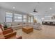 Spacious living room seamlessly connected to the kitchen, with modern decor and ample light at 9730 E Resistance Ave, Mesa, AZ 85212