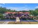 Outdoor dining with covered seating under red awnings, ready for residents to enjoy at 9730 E Resistance Ave, Mesa, AZ 85212