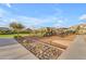 Community playground in residential neighborhood with slides, climbing structure, benches, and adjacent path at 9730 E Resistance Ave, Mesa, AZ 85212