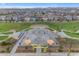 Aerial view of a neighborhood skate park featuring ramps and colorful shade structures surrounded by community homes at 9730 E Resistance Ave, Mesa, AZ 85212