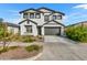 Charming two-story home featuring a two-car garage and a well-maintained front yard at 9759 E Satellite Dr, Mesa, AZ 85212