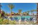 Resort-style community pool features ample seating and mature landscaping, offering a relaxing oasis at 9759 E Satellite Dr, Mesa, AZ 85212