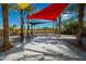 Interactive splash pad area with water features and colorful sunshades, surrounded by palm trees at 9759 E Satellite Dr, Mesa, AZ 85212