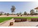 Backyard patio overlooking the landscaped golf course, offering a serene setting for outdoor enjoyment at 9837 E Michigan Ave, Sun Lakes, AZ 85248