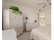 Bedroom area with neutral tones, ceiling fan and wicker dressers at 9837 E Michigan Ave, Sun Lakes, AZ 85248