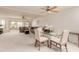 Spacious living room with plush carpeting, ceiling fan, and glass doors to the patio at 9837 E Michigan Ave, Sun Lakes, AZ 85248