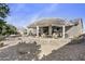 Lush backyard featuring a pergola-covered patio, lush landscaping, and privacy for a serene retreat at 10049 E Topaz Ave, Mesa, AZ 85212