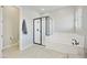 Bright bathroom featuring a sleek glass shower, modern bathtub, and neutral tile flooring at 10049 E Topaz Ave, Mesa, AZ 85212