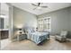 Bedroom with a ceiling fan, plantation shutters and a chair in the corner at 10049 E Topaz Ave, Mesa, AZ 85212