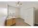 Bright bedroom with hardwood floors, a ceiling fan, closet, and plenty of natural light at 10049 E Topaz Ave, Mesa, AZ 85212