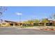 Exterior of the community welcome center, featuring a modern design, ample parking, and inviting landscaping at 10049 E Topaz Ave, Mesa, AZ 85212