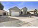 Charming single-story home with a well-manicured front yard and a spacious driveway at 10049 E Topaz Ave, Mesa, AZ 85212