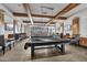 This game room features pool tables with TVs and plenty of seating to relax and socialize at 10049 E Topaz Ave, Mesa, AZ 85212