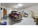 Spacious garage featuring a vintage car, ample storage, and a clean, well-maintained interior at 10049 E Topaz Ave, Mesa, AZ 85212