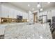 Bright kitchen features granite counters, stainless appliances, backsplash and a large island with seating at 10049 E Topaz Ave, Mesa, AZ 85212