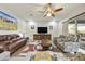 Spacious living room with a contemporary design, a cozy sofa, and a large media center for entertainment at 10049 E Topaz Ave, Mesa, AZ 85212