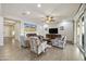 Inviting living room with a cozy seating arrangement, stylish decor, and sliding door access to the outdoors at 10049 E Topaz Ave, Mesa, AZ 85212