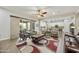 Open-concept living area showcasing a modern design, comfortable seating, and seamless access to the kitchen at 10049 E Topaz Ave, Mesa, AZ 85212