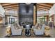 Cozy lobby area featuring a stone fireplace, comfortable seating, and stylish decor, creating a welcoming atmosphere at 10049 E Topaz Ave, Mesa, AZ 85212