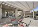 Beautiful covered patio area featuring stylish outdoor furniture and a relaxing atmosphere at 10049 E Topaz Ave, Mesa, AZ 85212