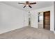 Neutral bedroom with a ceiling fan, closet with mirrored doors and neutral carpet offers comfort at 1007 W 5Th St, Mesa, AZ 85201