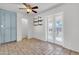 Bright dining area with tile floors, ceiling fan, and access to the backyard at 1007 W 5Th St, Mesa, AZ 85201