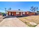 Attractive single-story brick house with a covered carport and mature trees at 1007 W 5Th St, Mesa, AZ 85201
