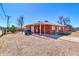 Cozy brick home featuring a covered carport and a gravel front yard at 1007 W 5Th St, Mesa, AZ 85201
