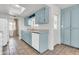 Classic kitchen with light blue cabinets, white appliances, and tile flooring at 1007 W 5Th St, Mesa, AZ 85201