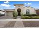 Charming single-story home with lush landscaping and a welcoming entrance with a covered entryway at 10145 E Cintron Dr, Mesa, AZ 85212
