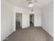 Bedroom featuring neutral carpet, ceiling fan, and closet space at 10410 N Cave Creek Rd # 2119, Phoenix, AZ 85020