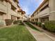 Inviting condo complex featuring lush landscaping, sidewalks and neutral exteriors at 10410 N Cave Creek Rd # 2119, Phoenix, AZ 85020