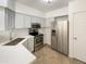 Updated kitchen featuring stainless steel appliances, granite counters, and ample cabinet space at 10410 N Cave Creek Rd # 2119, Phoenix, AZ 85020