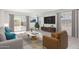 Bright living room with a neutral color scheme, modern furniture, and access to the backyard at 10619 W Sonrisas St, Tolleson, AZ 85353